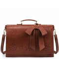 Monikas stilvolle Schleifenhandtasche