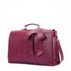 Monikas stilvolle Schleifenhandtasche